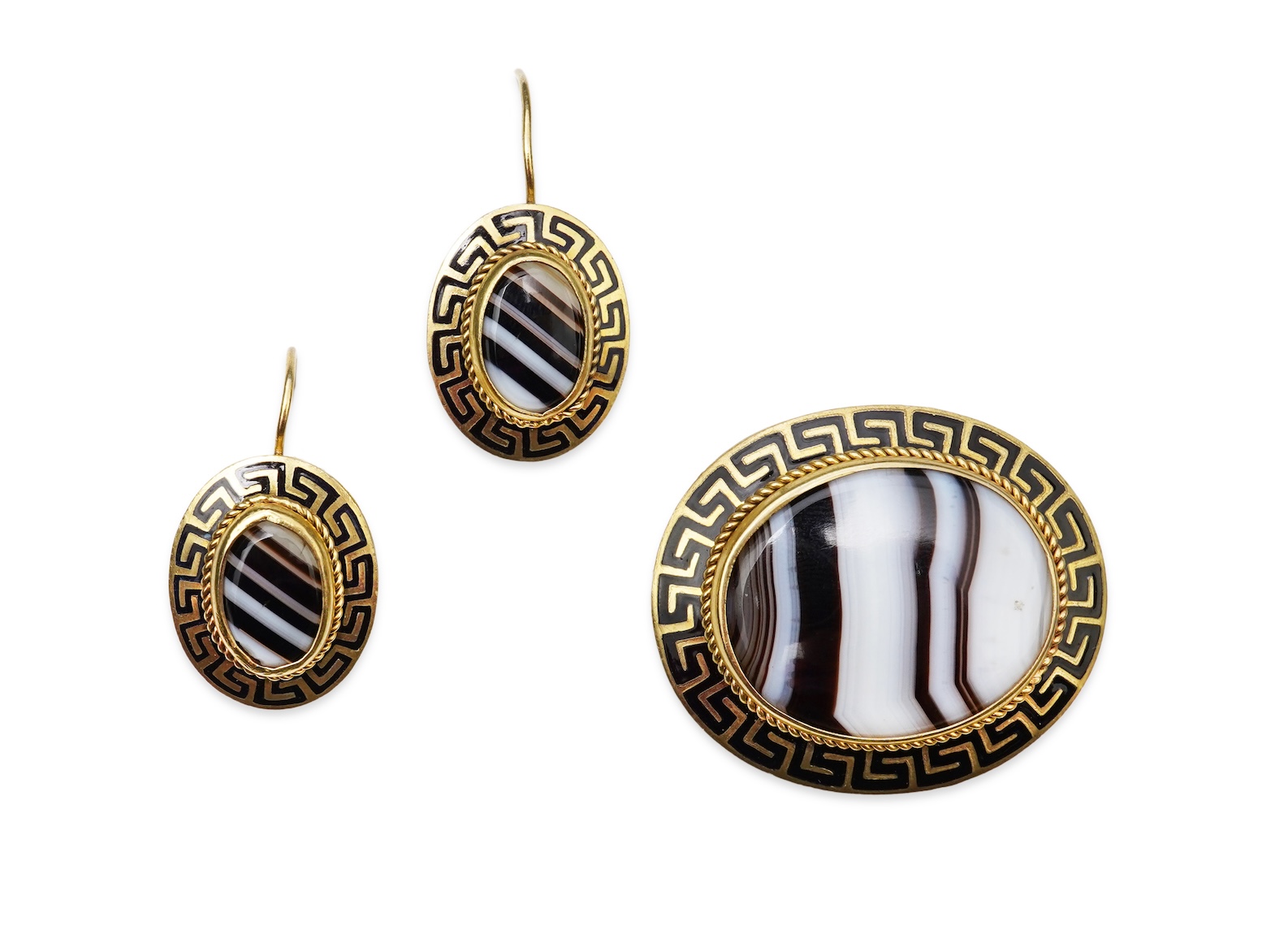 An enamel and onyx demi-parure, late 19th century